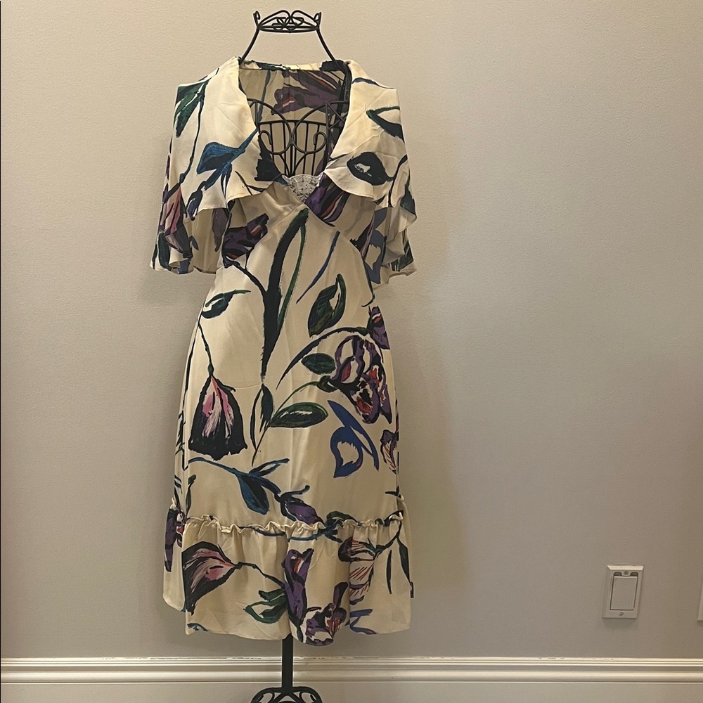 Corey Lynn Calter floral cape dress is a midi-length dress